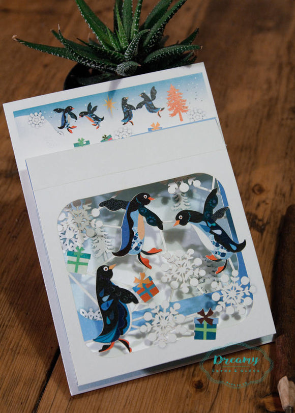 Penguins Christmas Card - award-winning luxury laser cut-out box design -made in England - dreamylondon