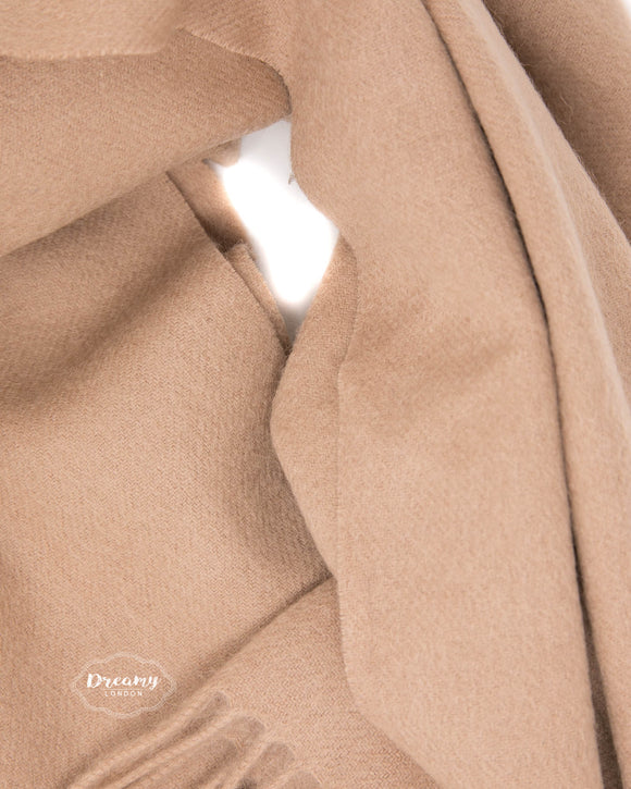 Model wearing a plain beige wool scarf - 100% pure wool - dreamylondon