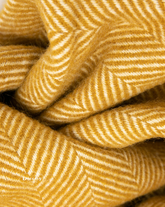 folded wool blanket in mustard yellow colour - dreamylondon